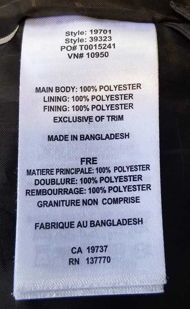 Sewn-in care label of an Elevate jacket showing Style 19701